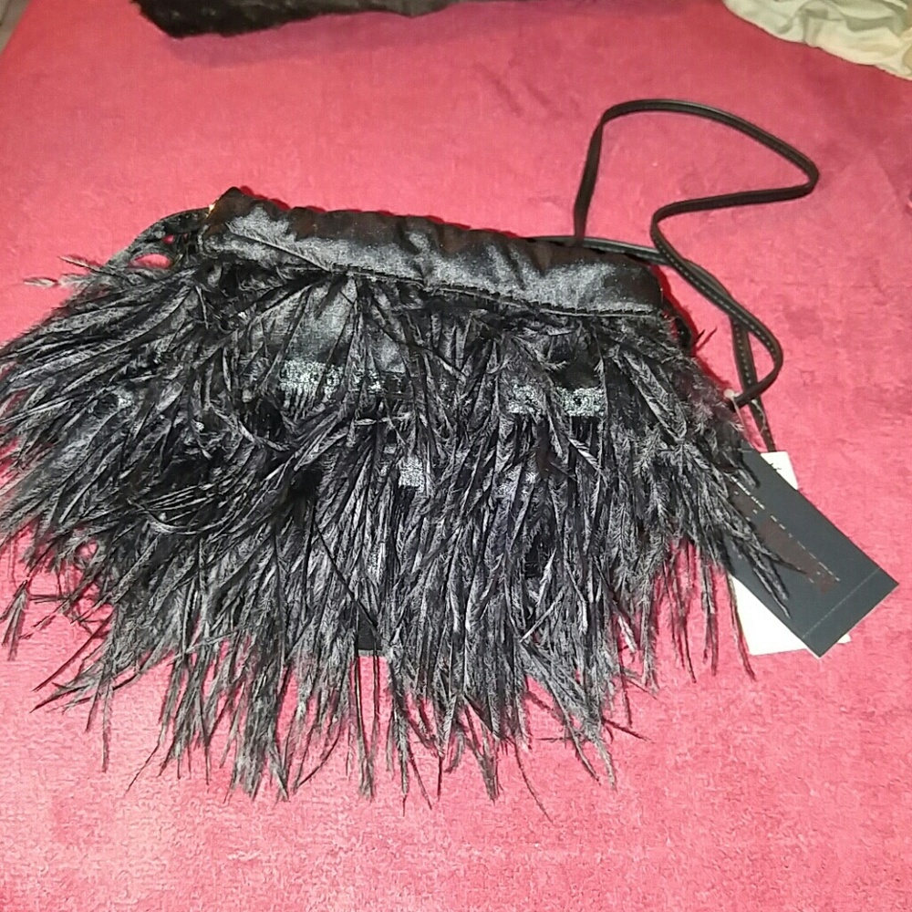 Unique Steve Madden small bucket bag.